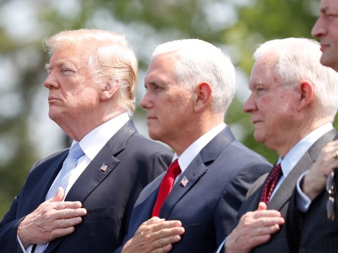 U.S. President Donald Trump stands with Vice President Mike Pence, Attorney General Jeff Sessions and Labor Secretary Alex Acosta at the 37th Annual National Peace Officers’ Memorial Service at the U.S. Capitol in Washington, U.S., May 15, 2018. REUTERS/Kevin Lamarque