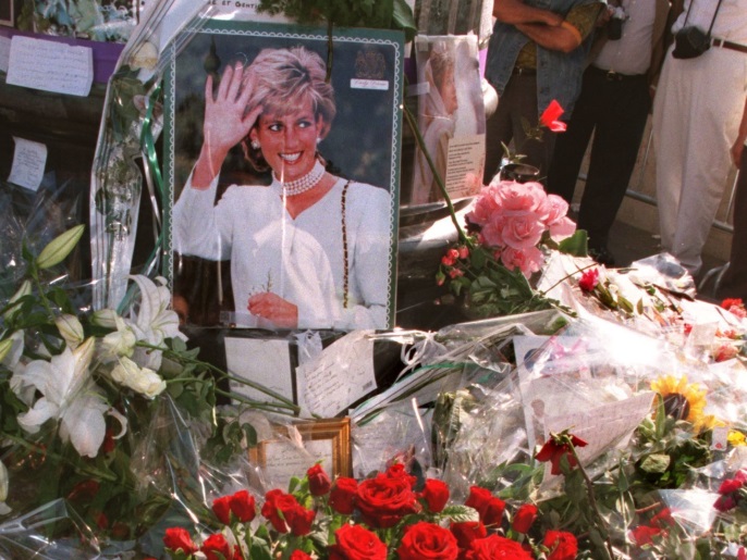 Flowers, portraits, candles and cards are pilled up August 31 above the underpass of Pont de l'Alma to mark the first anniversary of the death of Diana, Princess of Wales. Diana died in a high speed car crash in the underpass with her companion Dodi Fayed.CP/SB