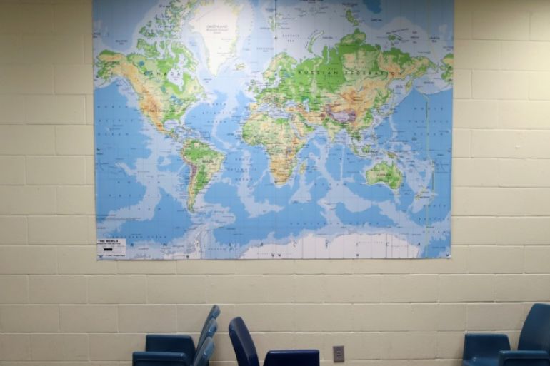 A world map is seen on the wall of the visiting area at the Adelanto immigration detention center, which is run by the Geo Group Inc (GEO.N), in Adelanto, California, U.S., April 13, 2017. REUTERS/Lucy Nicholson SEARCH