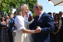 Austria's Foreign Minister Kneissl dances with Russia's President Putin at her wedding in Gamlitz