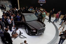 Journalists look over the Aurus Senat during its world presentation at the 2018 Moscow International Auto Salon in Moscow, Russia August 29, 2018. REUTERS/Maxim Shemetov