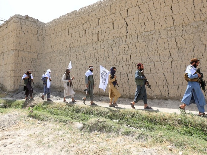 Taliban walk as they celebrate ceasefire in Ghanikhel district of Nangarhar province, Afghanistan June 16, 2018.REUTERS/Parwiz