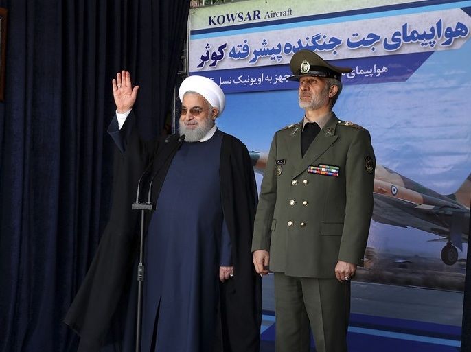 epa06961891 A handout photo made available by the Presidential Office of Iran shows Iranian president Hassan Rouhani (L) and Iranian Defense Minister Amir Hatami (R) during an inauguration ceremony for the unveiling of Iran's first home made fighter jets, the 'Kowsar', during an inauguration ceremony in Tehran, Iran, 21 August 2018. According to media reports, Iran unveiled its first domestic fighter jets during a defence exhibition in Tehran. President Rouhani stated that the advances in defensive capabilities are for national defence, and not as a prelude to starting a war. EPA-EFE/PRESIDENTIAL OFFICE OF IRAN / HA HANDOUT EDITORIAL USE ONLY/NO SALES