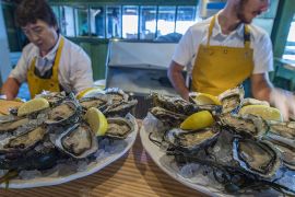 epa06222252 Oysters are seen in Boulan Restaurant in Lege Cap Ferret, south-west France, 23 September 2017. In the Arcachon basin (Gironde department), oyster culture is the second most important economic activity after tourism and Cap Ferret is called as 'Oyster Capital of France'. French aquaculture is largely dominated by the culture of shellfish, whether in volume or value, according to figures provided by the European Commission. France produced 154,000 tons of 'bivalves', mainly oysters (76,600 tons) and mussels (75,000 tons) out of 207,000 tons of aquaculture commodities in 2015. EPA-EFE/CAROLINE BLUMBERG