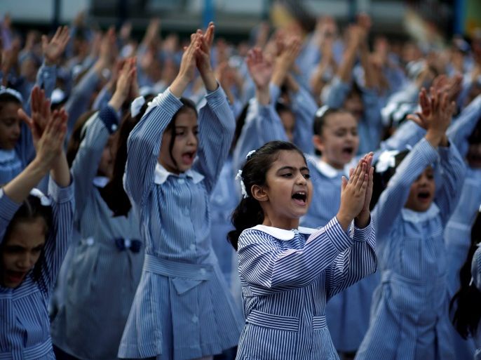 Palestinian schoolgirls participate in the morning exercise at an UNRWA-run school, on the first day of a new school year, in Gaza City August 29, 2018. REUTERS/Mohammed Salem