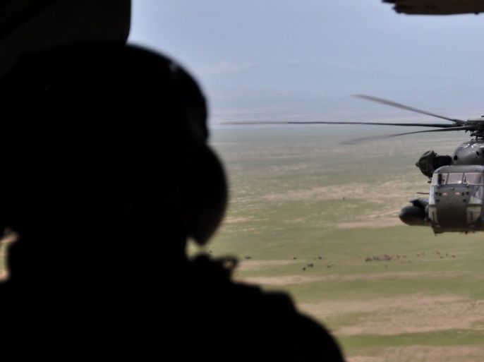 A soldier of the German armed forces Bundeswehr in a CH-53 helicopter on their way from Kunduz to Mazar-i-Sharif, Afghanistan on March 27, 2017. Picture taken March 27, 2017. REUTERS/Sabine Siebold