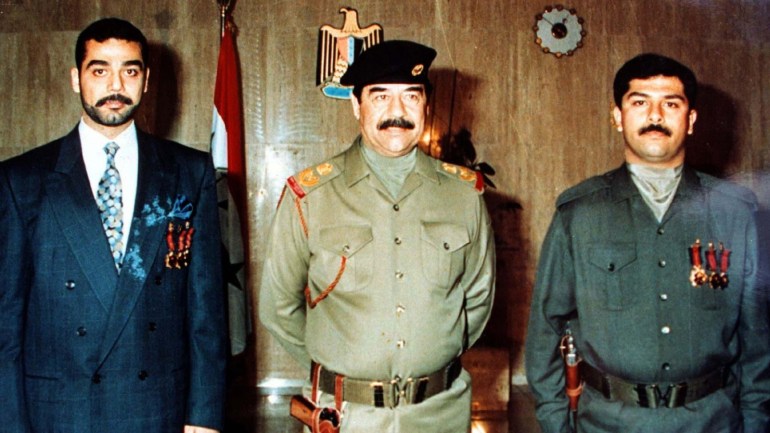 DATE IMPORTED:23 July, 2003President Saddam Hussein (C) is flanked by his two sons Uday (L) and Qusay (R) in a photo released by the Iraqi government December 13, 1996. The search for Saddam Hussein drew fresh impetus July 23, 2003 after U.S. soldiers killed his two sons Uday and Qusay in a fierce six-hour gunbattle in northern Iraq. REUTERS/Iraqi News Agency CLH/