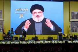 Lebanon's Hezbollah leader Sayyed Hassan Nasrallah gestures as he addresses his supporters via a screen in Beirut, Lebanon August 14, 2018. REUTERS/Aziz Taher