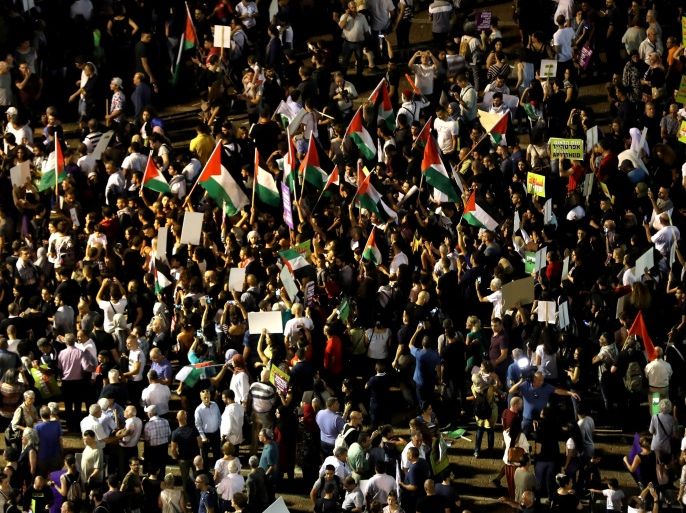 Israeli Arabs and their supporters take part in a rally to protest against Jewish nation-state law in Rabin square in Tel Aviv, Israel August 11, 2018. REUTERS/Ammar Awad