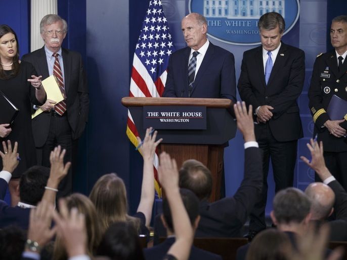 epa06924200 Director of National Intelligence Dan Coats (C), with White House Press Secretary Sarah Huckabee Sanders (L), National Security Advisor John Bolton (2-L), FBI Director Christopher Wray (2-R) and Director National Security Agency General Paul Nakasone (R), responds to a question from the news media during the daily briefing at the White House in Washington, DC, USA 02 August 2018. The intelligence officials responded to questions on election meddling and secu