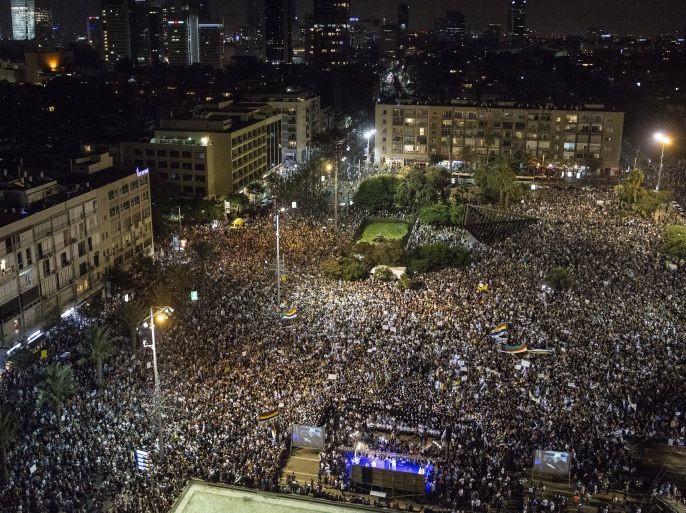 TEL AVIV, ISRAEL - AUGUST 04: General view shows Thousands of demonstrators take part in a protest against 'Jewish Nation State Law' in Rabin Square on August 4, 2018 in Tel Aviv, Israel. The rally organized by Druze community members is in protest of the law that declares Israel the exclusive homeland of Jewish people. (Photo by Amir Levy/Getty Images)