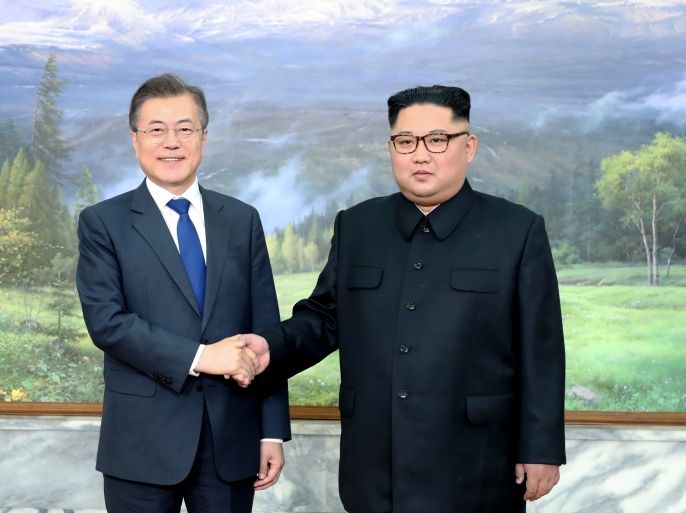 South Korean President Moon Jae-in shakes hands with North Korean leader Kim Jong Un during their summit at the truce village of Panmunjom, North Korea, in this handout picture provided by the Presidential Blue House on May 26, 2018. Picture taken on May 26, 2018. The Presidential Blue House /Handout via REUTERS ATTENTION EDITORS - THIS IMAGE WAS PROVIDED BY A THIRD PARTY