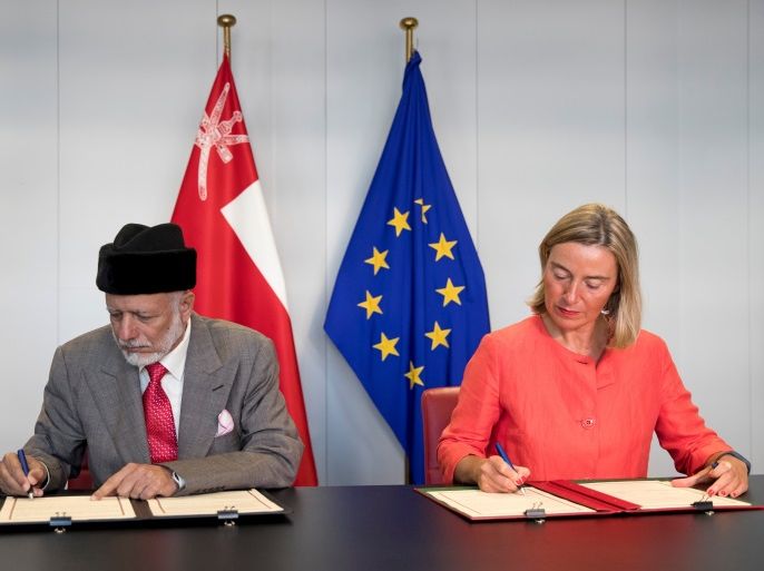 European Union Foreign Policy Chief Federica Mogherini and Omani Foreign Minister Yusuf bin Alawi bin Abdullah sign an agreement during their meeting at the European Commission headquarters in Brussels, Belgium, September 20, 2018. Francisco Seco/Pool via REUTERS