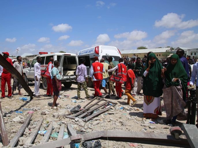 Bomb-laden vehicle attack in Somalia- - MOGADISHU, SOMALIA - SEPTEMBER 02: An injured citizen is being moved away from the site by health team members and security forces after an attack carried out with a bomb-laden vehicle on September 02, 2018 in Mogadishu, Somalia.