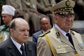 Algeria's President and head of the Armed Forces Abdelaziz Bouteflika (C) ,Army Chief of Staff General Ahmed Gaid Salah (R) and Abdelmalek Guenaizia, Minister Delegate to the Defence ministry attend a graduation ceremony of the 40th class of trainee army officers at a Military Academy in Cherchell 90 km west of Algiers June 27, 2012. REUTERS/Ramzi Boudina (ALGERIA - Tags: POLITICS)