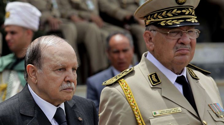 Algeria's President and head of the Armed Forces Abdelaziz Bouteflika (C) ,Army Chief of Staff General Ahmed Gaid Salah (R) and Abdelmalek Guenaizia, Minister Delegate to the Defence ministry attend a graduation ceremony of the 40th class of trainee army officers at a Military Academy in Cherchell 90 km west of Algiers June 27, 2012. REUTERS/Ramzi Boudina (ALGERIA - Tags: POLITICS)