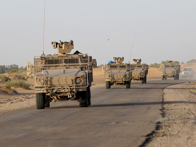 epa04920385 Military vehicles of the Saudi-led coalition forces drive towards the eastern province of Marib, Yemen, 08 September 2015. Troops from an alliance of Gulf states began marching towards the front lines with Houthi rebels in Marib province, east of the capital Sana'a. The troops moved from the Safer base, where three days earlier 60 coalition soldiers were killed in a missile strike claimed by the Houthi-controlled Yemeni Defence Ministry. EPA/STRINGER