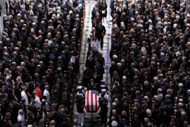 The casket is pictured leaving the memorial service of U.S. Senator John McCain (R-AZ) at National Cathedral in Washington, U.S., September 1, 2018. REUTERS/Chris Wattie