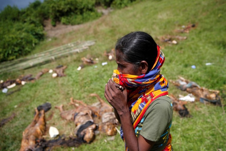 ATTENTION EDITORS - VISUAL COVERAGE OF SCENES OF INJURY OR DEATH A Hindu villager reacts while identifying the bodies of relatives found by government forces, that authorities suspected were killed by insurgents last month, in a mass grave near Maungdaw in the north of Myanmar's Rakhine state, September 27, 2017. The bodies of Hindu villagers are displayed by Myanmar authorities who say they were killed by Muslim insurgents, victims of a surge of violence in someone e