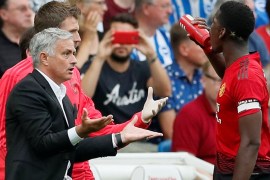 Soccer Football - Premier League - Brighton & Hove Albion v Manchester United - The American Express Community Stadium, Brighton, Britain - August 19, 2018 Manchester United manager Jose Mourinho speaks with Paul Pogba REUTERS/David Klein EDITORIAL USE ONLY. No use with unauthorized audio, video, data, fixture lists, club/league logos or