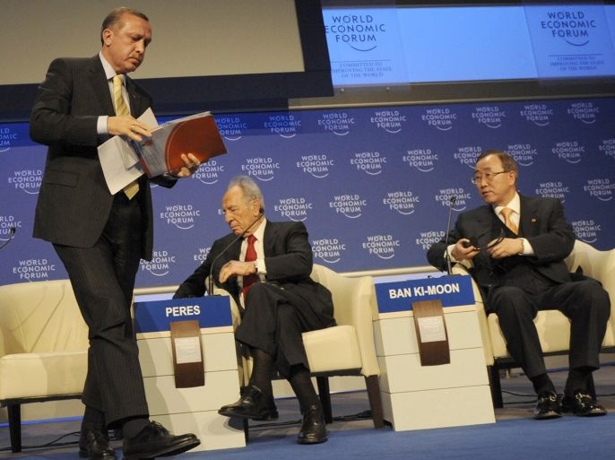 Turkey's Prime Minister Tayyip Erdogan storms out of a debate on the Middle East at the World Economic Forum in Davos January 29, 2009 as Israel's President Shimon Peres (2nd R), United Nations Secretary General Ban Ki-Moon (R), Arab League chief Amr Moussa (seen at far right in the screen) and Associate Editor and Columnist of The Washington Post David Ignatius (L) remain seated. Israel's President Shimon Peres had launched a fiery defence of his country's assault on Gaza over the past month and, with a raised voice and pointed finger, questioned what Erdogan would do if rockets were fired at Istanbul every night. As the debate was ending, Erdogan was cut short as he tried to respond. REUTERS/Yasin Aras/Anatolian (SWITZERLAND). TURKEY OUT. NO COMMERCIAL OR EDITORIAL SALES IN TURKEY.