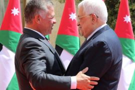 Palestinian president Mahmoud Abbas (R) greets King Abdullah II of Jordan as he arrives to meet with him at the Royal Palace in Amman, Jordan August 8, 2018. Khalil Mazraawi/Pool via REUTERS
