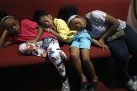 DETROIT, MI - AUGUST 19: Children sleep in a pew while waiting to listen to Rev. Jesse Jackson speak at New Bethel Baptist Church, the church where Aretha Franklin's late father Rev. C.L. Franklin was a minister and where she began her singing career, August 19, 2018 in Detroit, Michigan. Aretha Franklin died in Detroit of pancreatic cancer on August 16th at the age of 76. Bill Pugliano/Getty Images/AFP== FOR NEWSPAPERS, INTERNET, TELCOS & TELEVISION USE ONLY ==