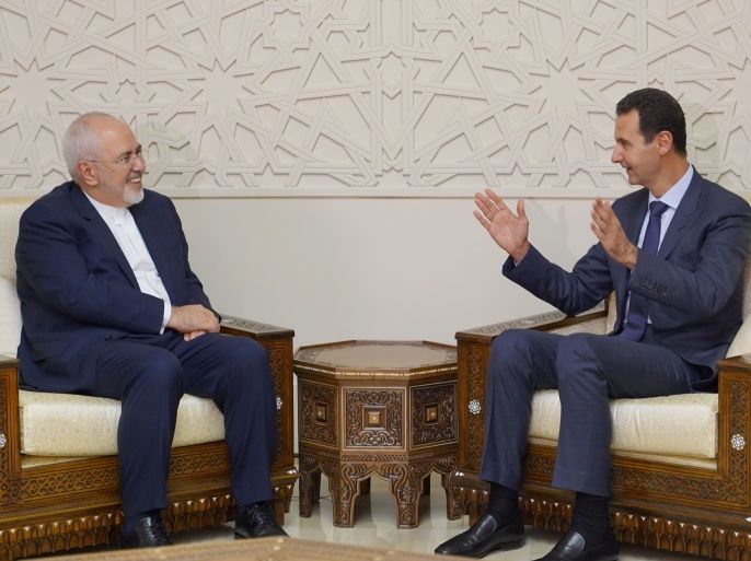 Syrian President Bashar al-Assad meets with Iran's Foreign Minister Mohammad Javad Zarif in Damascus, Syria September 3, 2018. SANA/Handout via REUTERS ATTENTION EDITORS - THIS IMAGE WAS PROVIDED BY A THIRD PARTY. REUTERS IS UNABLE TO INDEPENDENTLY VERIFY THIS IMAGE.