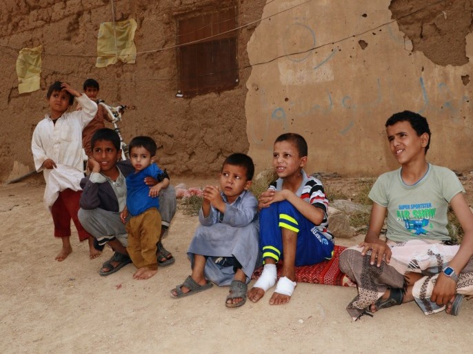 Boys including some of those who survived last month's air strike that killed dozens of people including children, sit outside a house in Saada, Yemen September 5, 2018. Picture taken September 5, 2018. REUTERS/Naif Rahma