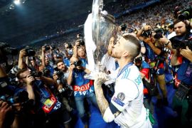 Soccer Football - Champions League Final - Real Madrid v Liverpool - NSC Olympic Stadium, Kiev, Ukraine - May 26, 2018 Real Madrid's Sergio Ramos kisses the trophy as he celebrates winning the Champions League REUTERS/Kai Pfaffenbach TPX IMAGES OF THE DAY
