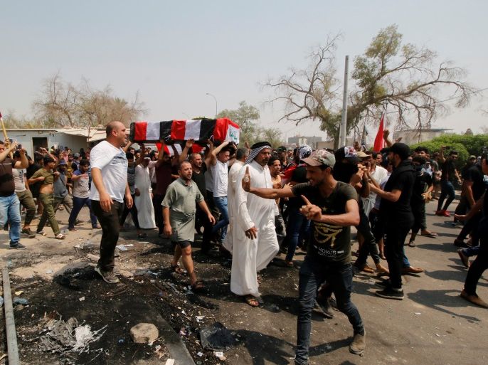 Mourners carry the coffin of a protester, who was killed in clashes with security forces in Basra, Iraq September 4, 2018. REUTERS/Essam al-Sudani