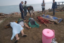 ATTENTION EDITORS - VISUAL COVERAGE OF SCENES OF INJURY OR DEATH People examine the remains of earthquake and tsunami victims on a beach in Palu, Central Sulawesi, Indonesia September 29, 2018 in this photo taken by Antara Foto. Picture taken September 29, 2018. Antara Foto/Zainuddin Mn/ via REUTERS ATTENTION EDITORS - THIS IMAGE WAS PROVIDED BY A THIRD PARTY. MANDATORY CREDIT. INDONESIA OUT. NO COMMERCIAL OR EDITORIAL SALES IN INDONESIA. TEMPLATE OUT