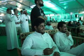 JEDDAH, SAUDI ARABIA - JUNE 25: Men and women watch the Saudi Arabia vs. Egypt 2018 World Cup match at a public viewing in a tent on June 25, 2018 in Jeddah, Saudi Arabia. The Saudi government, under Crown Prince Mohammad Bin Salman, is phasing in an ongoing series of reforms to both diversify the Saudi economy and to liberalize its society. The reforms also seek to empower women by restoring them basic legal rights, allowing them increasing independence and encouraging their participation in the workforce. Saudi Arabia is among the most conservative countries in the world and women have traditionally had much fewer rights than men. (Photo by Sean Gallup/Getty Images)