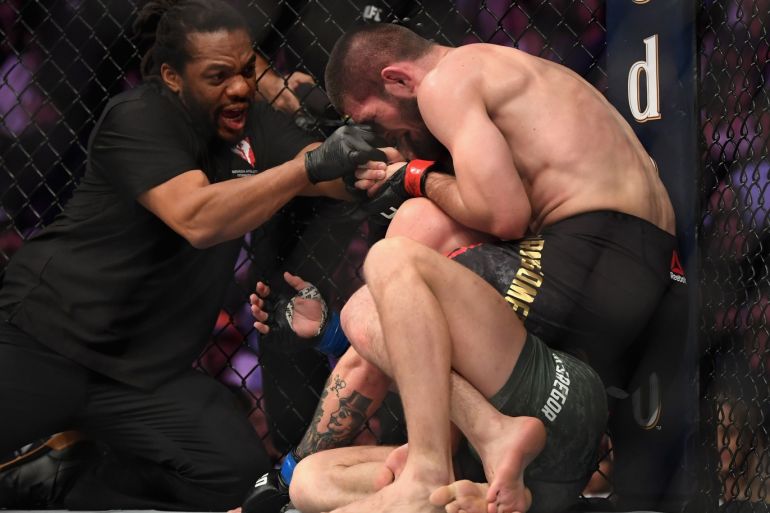 LAS VEGAS, NV - OCTOBER 06: Referee Herb Dean separates Khabib Nurmagomedov of Russia from Conor McGregor of Ireland after McGregor tapped out in their UFC lightweight championship bout during the UFC 229 event inside T-Mobile Arena on October 6, 2018 in Las Vegas, Nevada. Harry How/Getty Images/AFP== FOR NEWSPAPERS, INTERNET, TELCOS &amp; TELEVISION USE ONLY ==