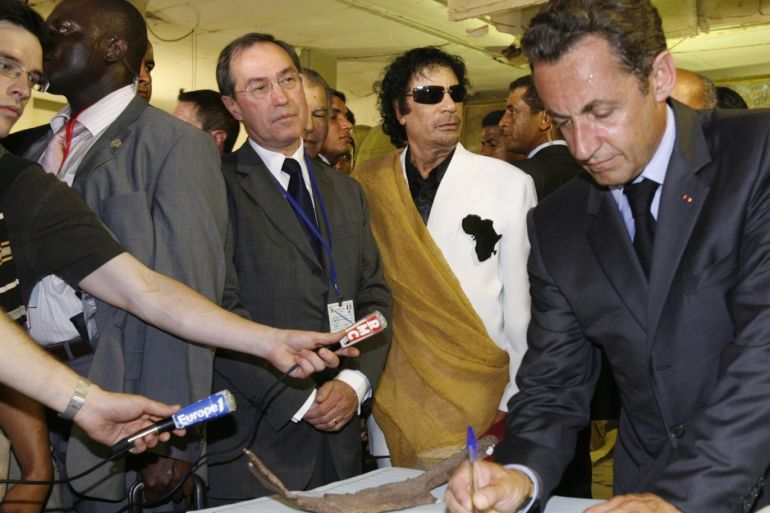 Libya's President Muammar Gaddafi (2ndR), French President Nicolas Sarkozy (R) and Claude Gueant (2ndL), General Secretary of the Elysee Palace, visit Bab Azizia Palace in Tripoli July 25, 2007 the day after the release of six foreign medics from Libyan jails. France has opened a judicial investigation into allegations that former President Nicolas Sarkozy's 2007 election bid won illicit funds from late Libyan leader Muammar Gaddafi, the public prosecutor's office said on Friday. An official at the prosecutor's office said an inquiry had been opened after allegations made by a Franco-Lebanese businessman Ziad Takieddine, himself under investigation in a separate affair of arms sales to Pakistan in the 1990's. Picture taken July 25, 2007 REUTERS/Pascal Rossignol (LIBYA - Tags: POLITICS CRIME LAW)