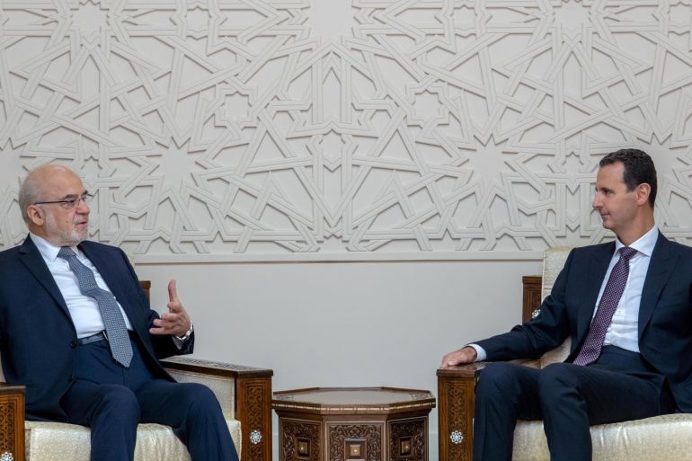 Syrian President Bashar al-Assad meets with Iraqi Foreign Minister Ibrahim al-Jaafari in Damascus, Syria October 15, 2018. SANA/Handout via REUTERS ATTENTION EDITORS - THIS IMAGE WAS PROVIDED BY A THIRD PARTY. REUTERS IS UNABLE TO INDEPENDENTLY VERIFY THIS IMAGE