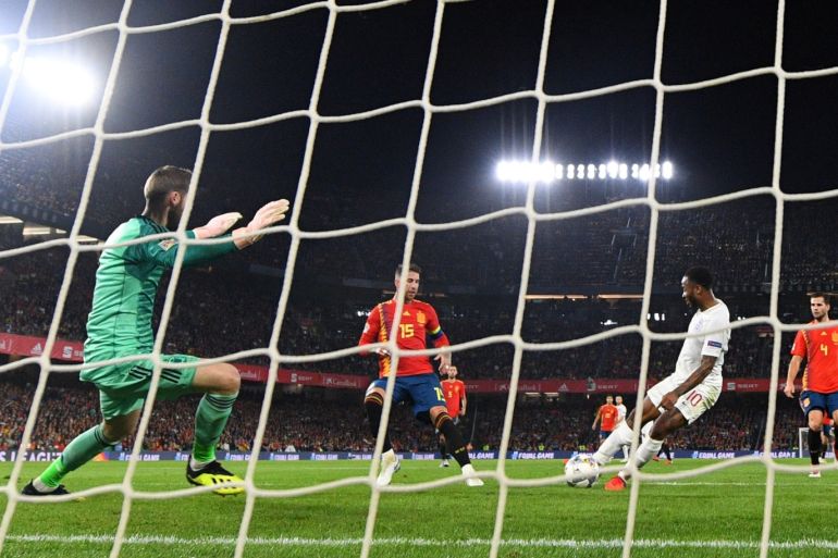 SEVILLE, SPAIN - OCTOBER 15: Raheem Sterling of England scores his team's third goal past David de Gea of Spain during the UEFA Nations League A Group Four match between Spain and England at Estadio Benito Villamarin on October 15, 2018 in Seville, Spain. (Photo by David Ramos/Getty Images)