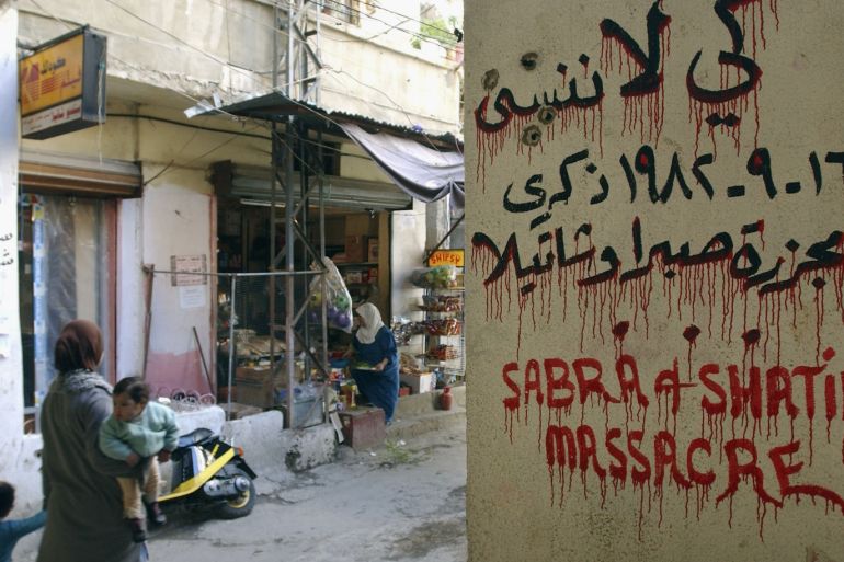 BEIRUT, LEBANON - FEBRUARY 22: A Palestinian woman passes by the graveyard of the massacred Sabra and Shatilla martyrs in the refugee camp of Shatilla on February 22, 2005, in Beirut, Lebanon. There are around 368,000 registered Palestinian refugees in Lebanon with approximately 200,000 of them living in 12 official refugee camps. The conditions in the camps are dire with water shortages, contaminated water and poor sanitation severely affecting residents' health. Leba