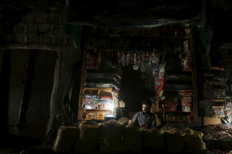A spices vendor waits for customers in his shop at the old quarter of Yemen's capital Sanaa amid a power outage June 22, 2015. Electricity has been cut off in the Yemeni capital and most of the country for more than two months now due to attacks on power lines amid fighting between Houthi rebels and tribal militants loyal to the country's President Abd-Rabbu Mansour Hadi. REUTERS/Khaled Abdullah