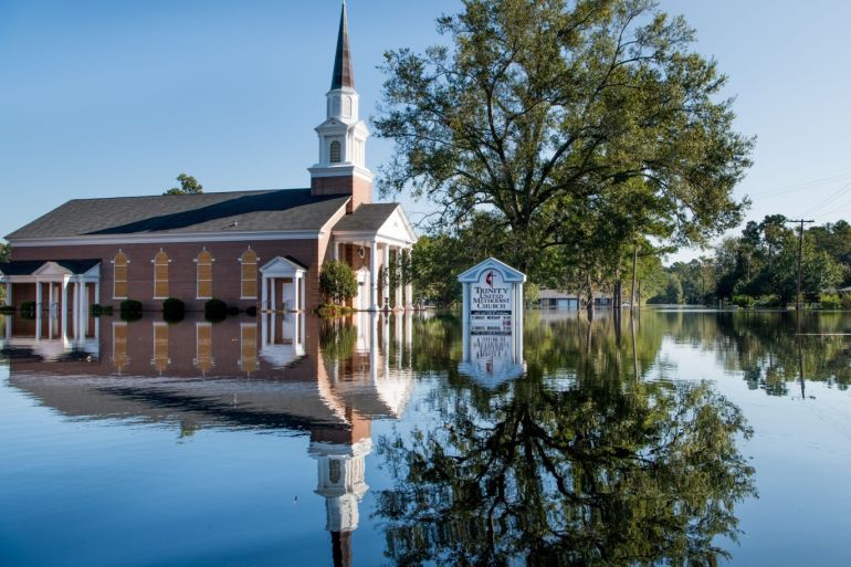 CONWAY, SC - SEPTEMBER 26: Trinity United Methodist Church is inundated by floodwaters caused by Hurricane Florence near the Crabtree Swamp on September 26, 2018 in Conway, South Carolina. Nearly two weeks after making landfall in North Carolina, river flooding continues in northeastern South Carolina. Sean Rayford/Getty Images/AFP== FOR NEWSPAPERS, INTERNET, TELCOS & TELEVISION USE ONLY ==