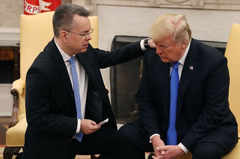 WASHINGTON, DC - OCTOBER 13: U.S. President Donald Trump and American evangelical Christian preacher Andrew Brunson (L) participate in a prayer a day after he was released from a Turkish jail, in the Oval Office, on October 13, 2018 in Washington, DC. Brunson was detained for two years in Turkey on espionage and terrorism-related charges that the pastor said were false. Mark Wilson/Getty Images/AFP== FOR NEWSPAPERS, INTERNET, TELCOS & TELEVISION USE ONLY ==