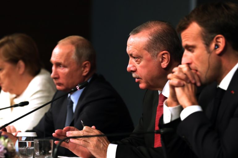 Four-way Istanbul summit on Syria- - ISTANBUL, TURKEY - OCTOBER 27: President of Turkey, Recep Tayyip Erdogan (2nd R), Russian President Vladimir Putin (2nd L), German Chancellor Angela Merkel (L) and French President Emmanuel Macron (R) hold a joint press conference at Vahdettin Mansion within the ''Four-way Istanbul summit on Syria'' in Istanbul, Turkey on October 27, 2018. The summit on Syria, hosted by Turkish President Recep Tayyip Erdogan, will see the participation of Russian President Vladimir Putin, German Chancellor Angela Merkel and French President Emmanuel Macron.