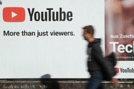 BERLIN, GERMANY - OCTOBER 05: A man walks past a billboard advertisement for YouTube on October 5, 2018 in Berlin, Germany. YouTube has established itself as the biggest global platform for online video presentations. (Photo by Sean Gallup/Getty Images)