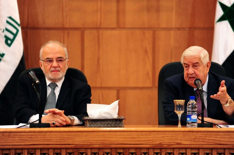 Syrian Foreign Minister Walid al-Moualem gestures during a news conference with his Iraqi counterpart Ibrahim al-Jaafari in Damascus, Syria October 15, 2018. SANA/Handout via REUTERS ATTENTION EDITORS - THIS IMAGE WAS PROVIDED BY A THIRD PARTY. REUTERS IS UNABLE TO INDEPENDENTLY VERIFY THIS IMAGE