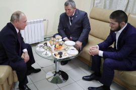 Russian President Vladimir Putin (L) meets with mixed martial arts fighter Khabib Nurmagomedov of Russia (R), UFC lightweight champion who recently defeated Conor McGregor of Ireland in the main event of UFC 229, and his father Abdulmanap Nurmagomedov on the sidelines of a sports forum in Ulyanovsk, Russia October 10, 2018. Sputnik/Mikhail Klimentyev/Kremlin via REUTERS ATTENTION EDITORS - THIS IMAGE WAS PROVIDED BY A THIRD PARTY.