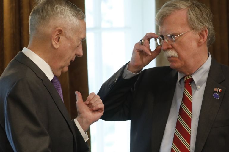 U.S. Defense Secretary Jim Mattis (L) talks with National Security Adviser John Bolton during a bilateral meeting between U.S. President Donald Trump and French President Emmanuel Macron in the Cabinet Room at the White House in Washington, U.S., April 24, 2018. REUTERS/Kevin Lamarque