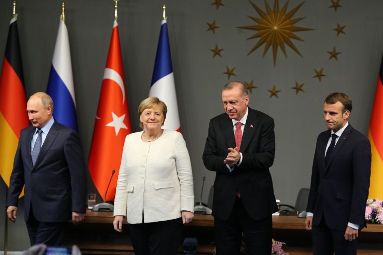 Four-way Istanbul summit on Syria- - ISTANBUL, TURKEY - OCTOBER 27: President of Turkey, Recep Tayyip Erdogan (2R), Russian President Vladimir Putin (L), German Chancellor Angela Merkel (2L) and French President Emmanuel Macron (R) are seen after holding a joint press conference at Vahdettin Mansion within the ''Four-way Istanbul summit on Syria'' in Istanbul, Turkey on October 27, 2018. The summit on Syria, hosted by Turkish President Recep Tayyip Erdogan, will see