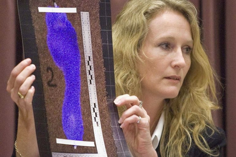 CHRISTCHURCH, NEW ZEALAND - MAY 19: Anna Sandiford holds a picture of David Bain's bloodied foot treated with Luminol used during the tests during the continuation of David Bain's retrial at Christchurch High Court on May 19, 2009 in Christchurch, New Zealand. David Bain was convicted in 1995 for murdering his family and served 12 years of his life sentence. On his final appeal in 2007 the Privy Council quashed his convictions and recommended a retrial. (Photo by John Kirk-Anderson/Getty Images)