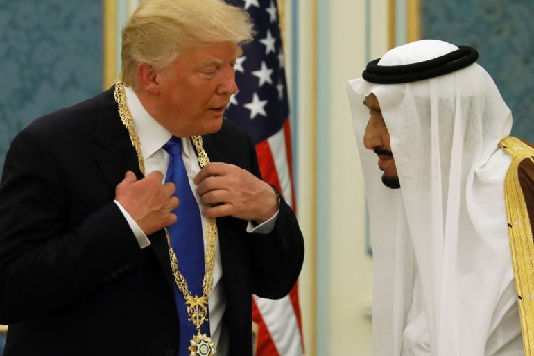 Saudi Arabia's King Salman bin Abdulaziz Al Saud (R) presents U.S. President Donald Trump with the Collar of Abdulaziz Al Saud Medal at the Royal Court in Riyadh, Saudi Arabia May 20, 2017. REUTERS/Jonathan Ernst TPX IMAGES OF THE DAY