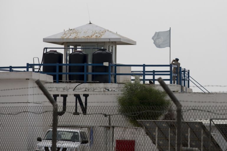 epa06925584 UN peacekeeper keeps watch on his tower at a UN base located in the south of the Golan Heights in the Israeli-Syrian border, near Mitzar, 03 August 2018. According to a Russian Defense Ministry spokesman, UN peacekeepers have returned to patrol the frontier between Israeli and Syria in the Golan Heights for the first time since 2014. EPA-EFE/ATEF SAFADIh